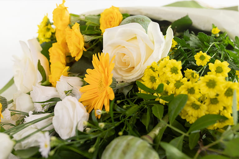 ellow and white roses with seasonal flowers