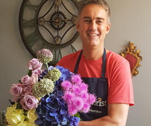 Simon Stirling holding bouquet