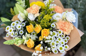 Handcrafted bouquet featuring seasonal flowers