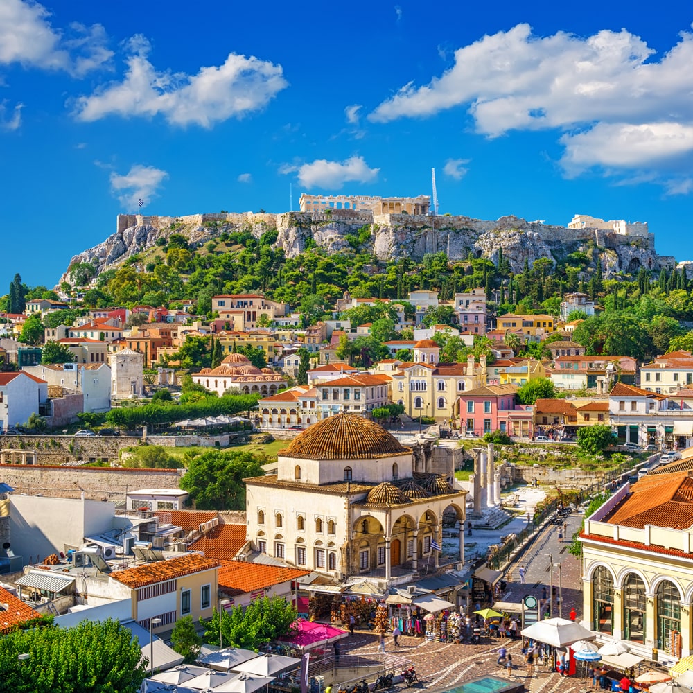 Athens cityscape with the Acropolis towering above colourful buildings and markets.