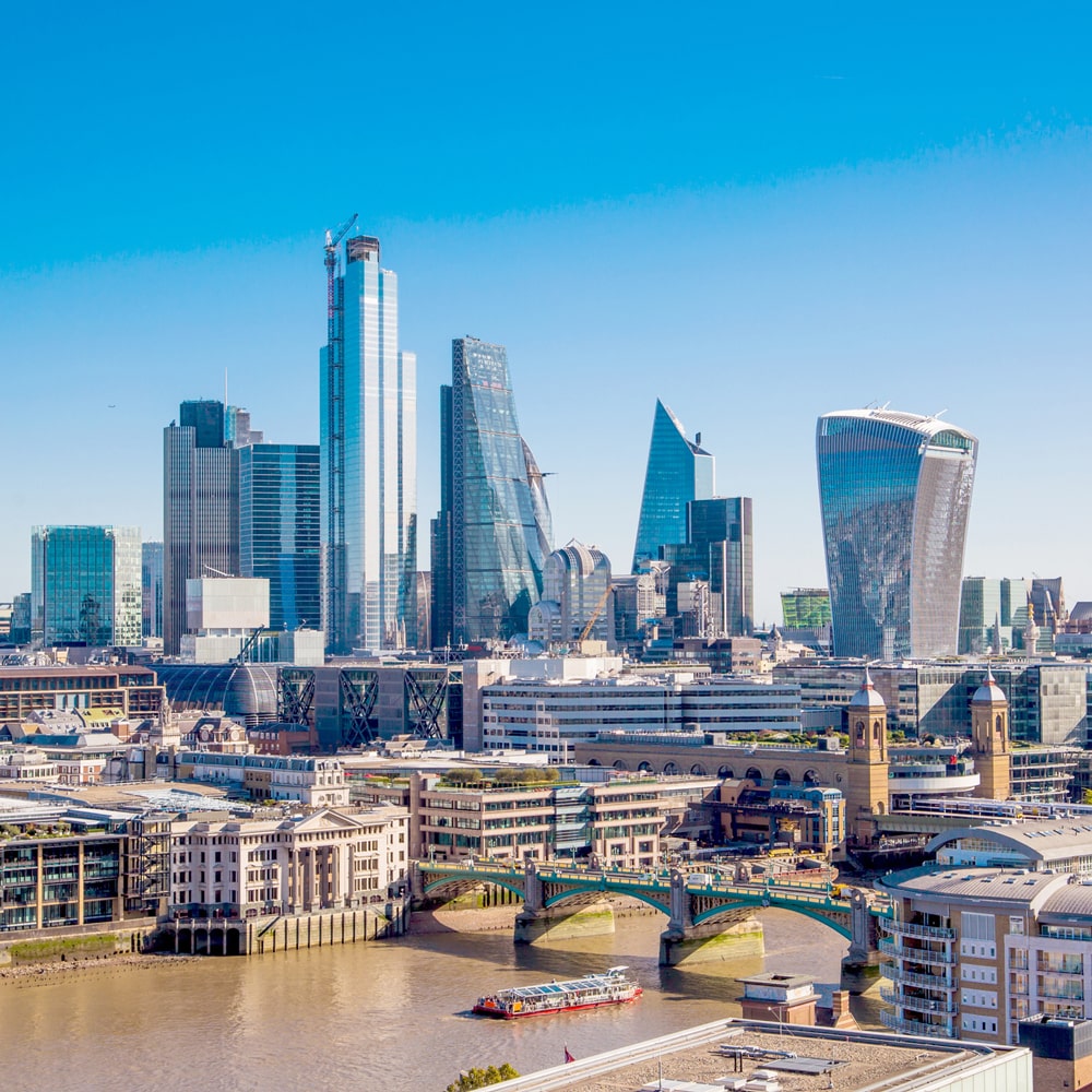 London cityscape with modern skyscrapers and the River Thames.