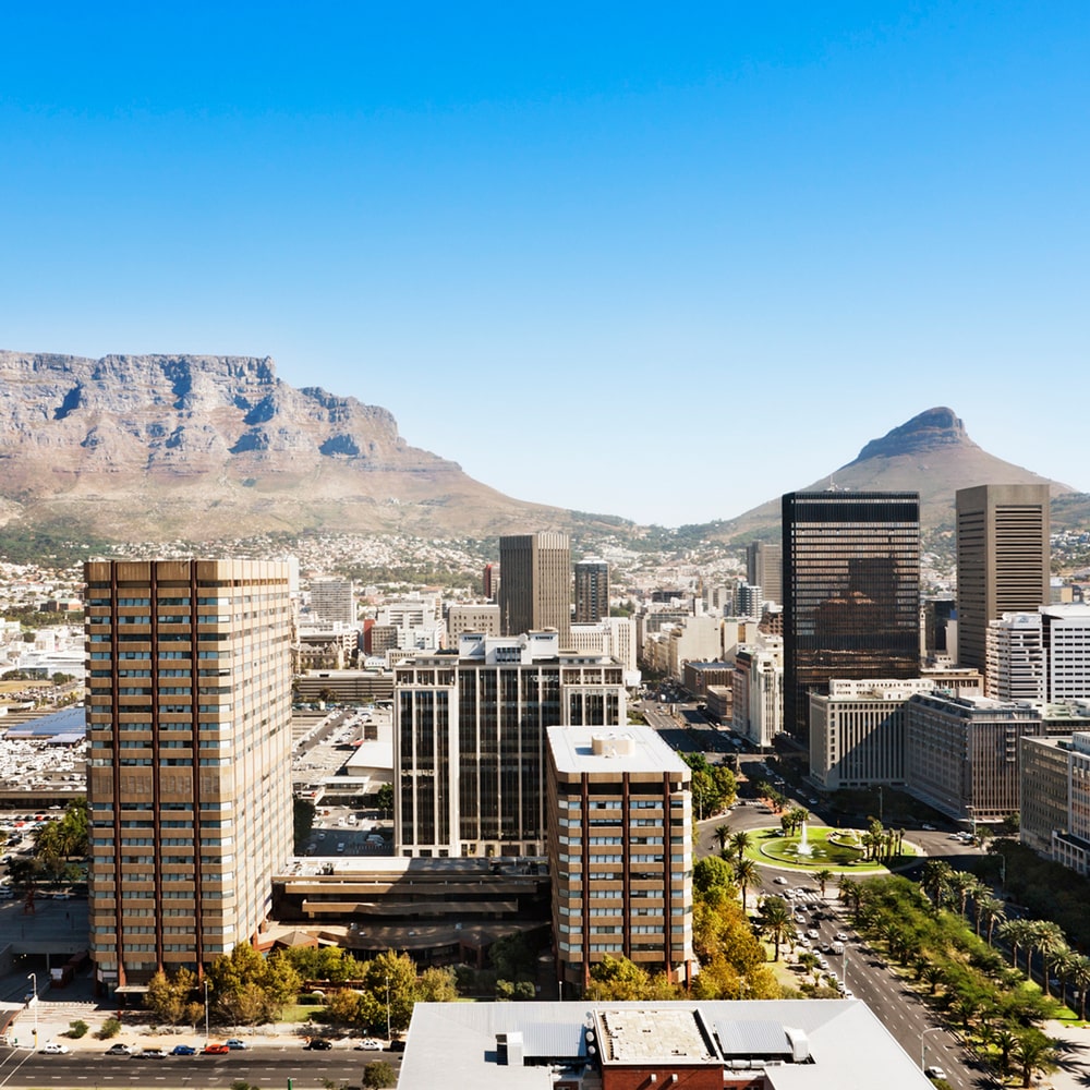 Cape Town skyline with Table Mountain and Lion's Head in the background.