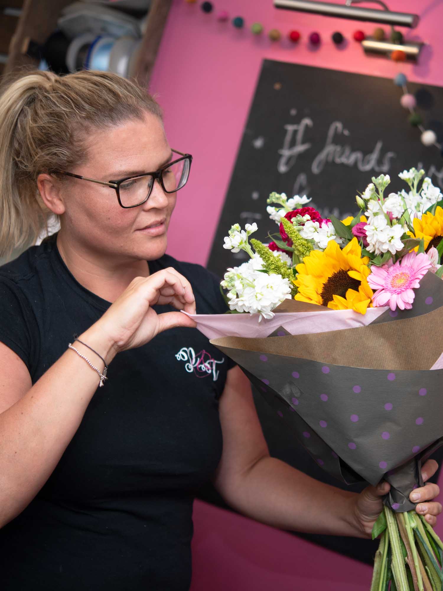 Local florist preparing colourful bouquet in shop for delivery in Ireland
