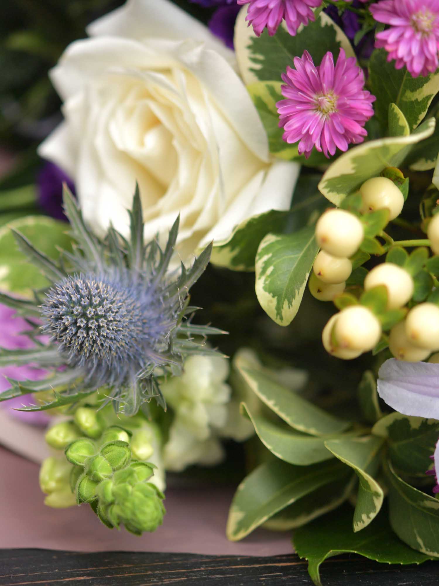Close up of funeral flowers being arranged by the local florist in Ireland