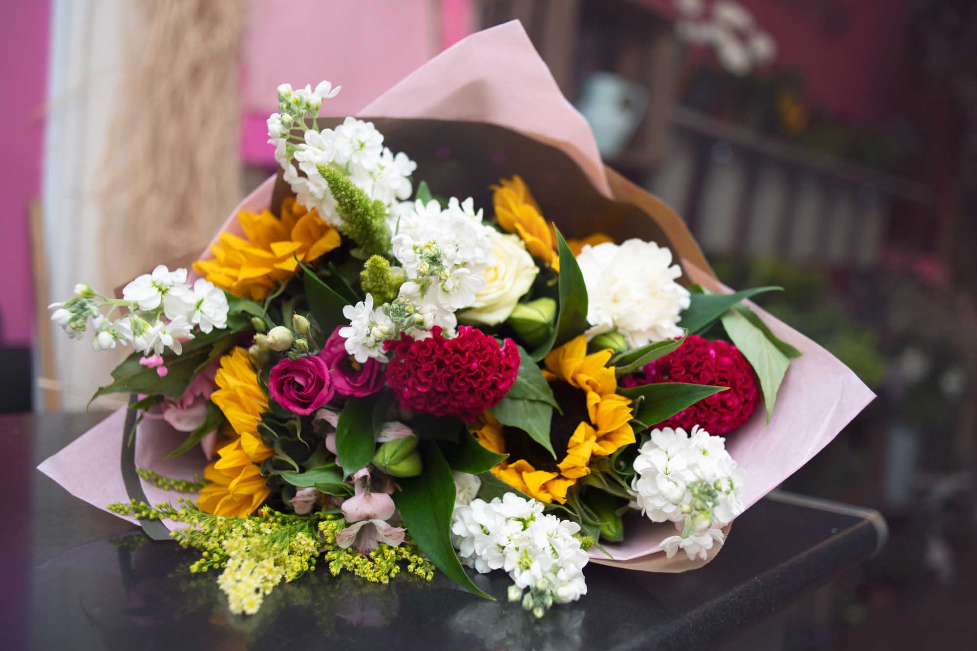 Hand-tied bouquet with bright mums and blooms