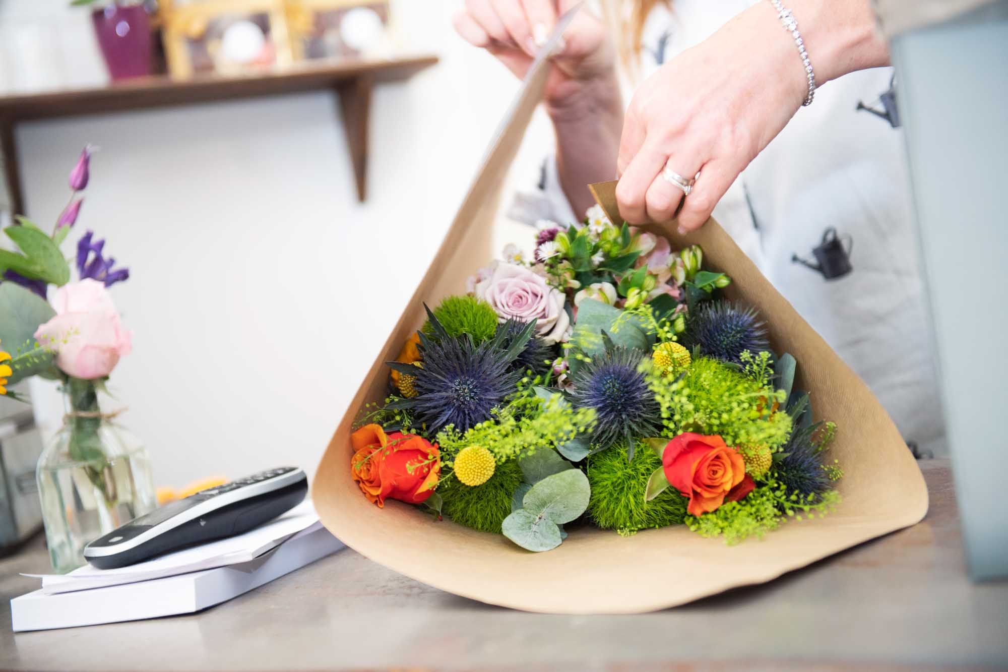 Florist in Ireland adding final touches to fashionable floral wrap