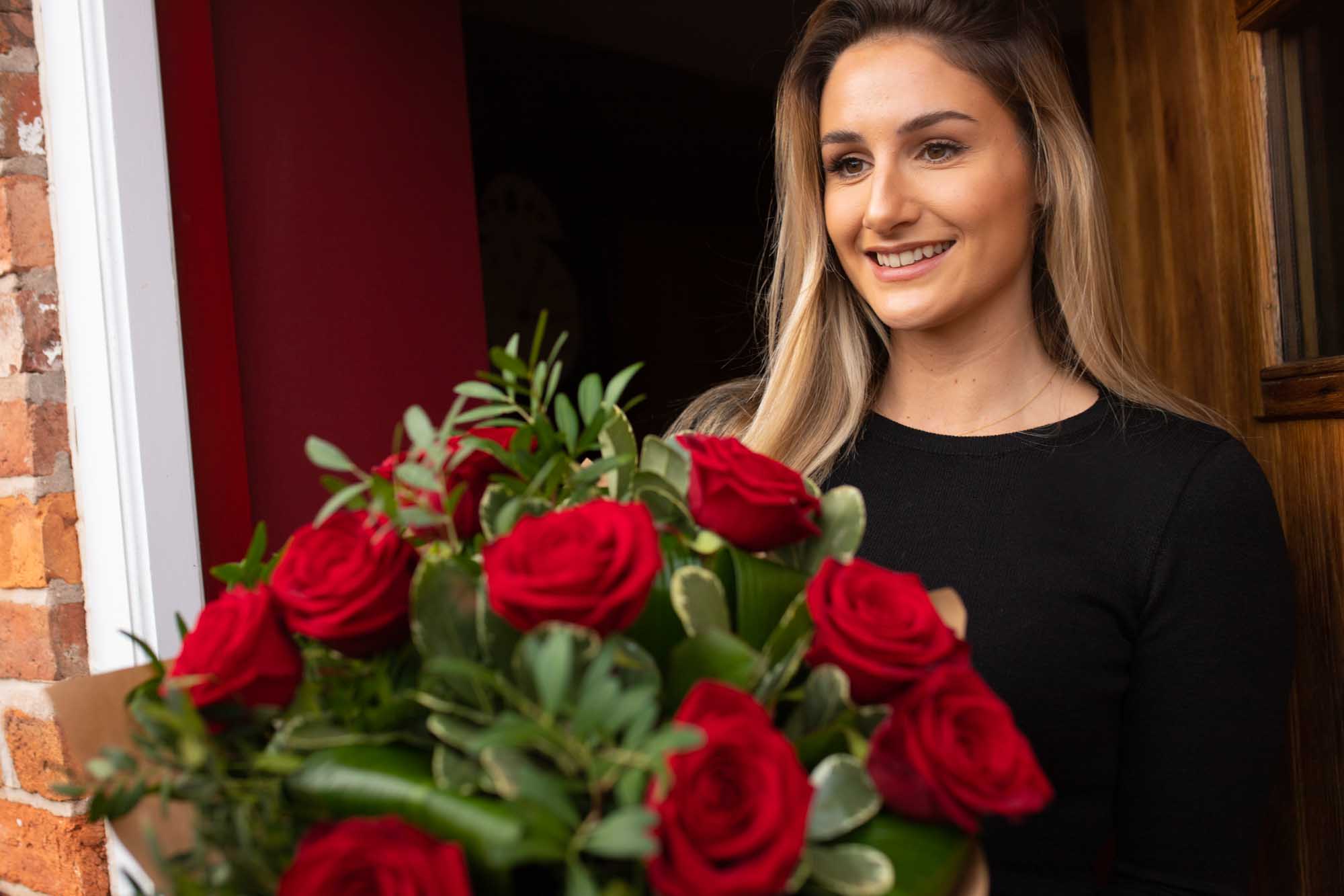 Lady receives Valentine's Day roses at her door step in Ireland.