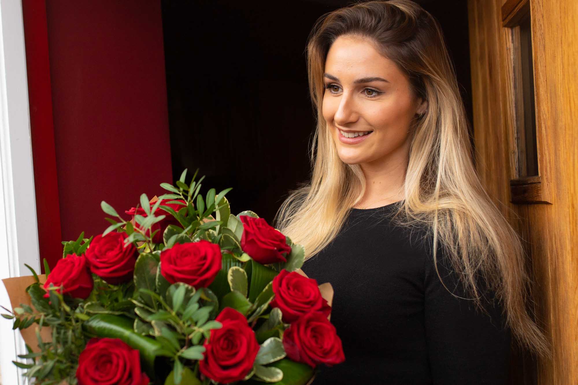 Valentine's Day flower delivery of red roses to ladies door in Ireland