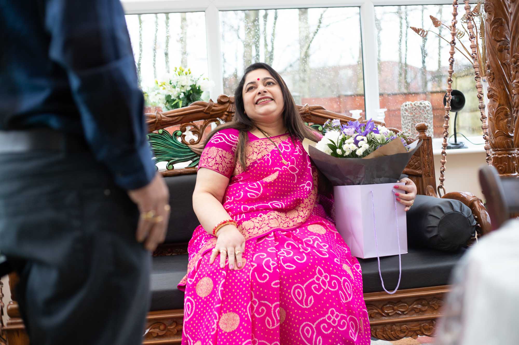 Bouquet of flowers for Diwali celebration with woman seated